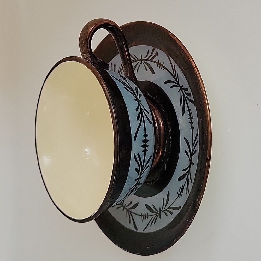 Antique lusterware teacup with saucer